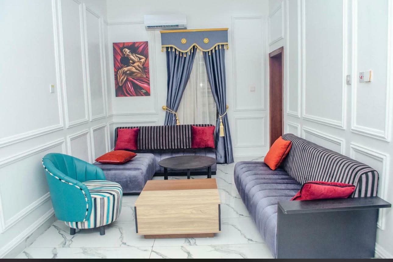 Warm hotel lobby interior with marble floors and brass fixtures